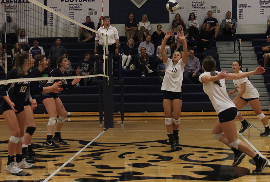 Sophomore Whitney VanDyke sets the ball for senior Ava Taton to hit.