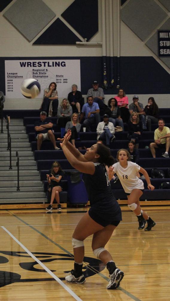 Junior Sydney Pullen sets the ball for a teammate to receive.