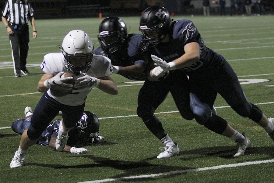 With 7:22 left in the fourth quarter, junior Logan Talley dives into the endzone to score a touchdown, bringing the score to 35-23.