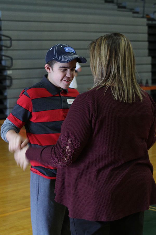 Freshmen Rylan Rothgeb dances with his teacher Mrs.Evans. 