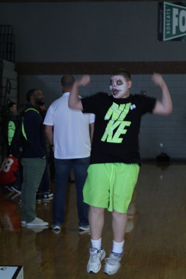 Jumping in joy, sophomore Jared Brehaney wins in a game of cornhole. 