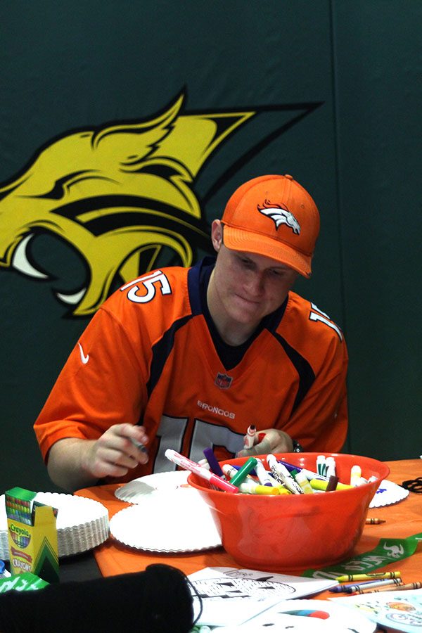 Junior Zachary Dixon participates at the coloring station. 