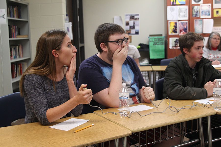 After hearing the correct answer to a question, senior Madeline Myrick covers her mouth in shock. 