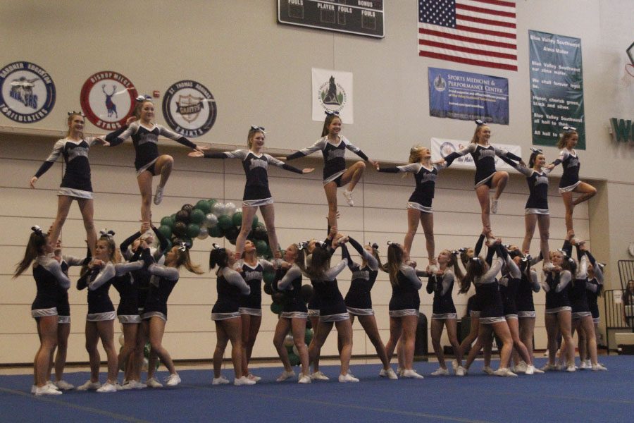 For the final stunt of the routine, eight fliers hold hands in the competition on Saturday, Nov. 11. 