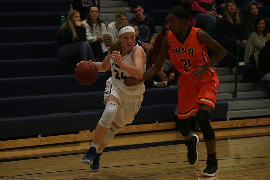 During the Lady Jags game against Shawnee Mission Northwest on Thursday Nov. 30, Evan Zars drives to the basket.