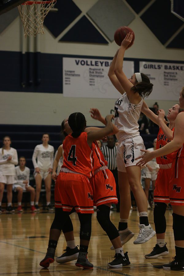 After getting her own rebound, junior Trinity Knapp scores the putback.