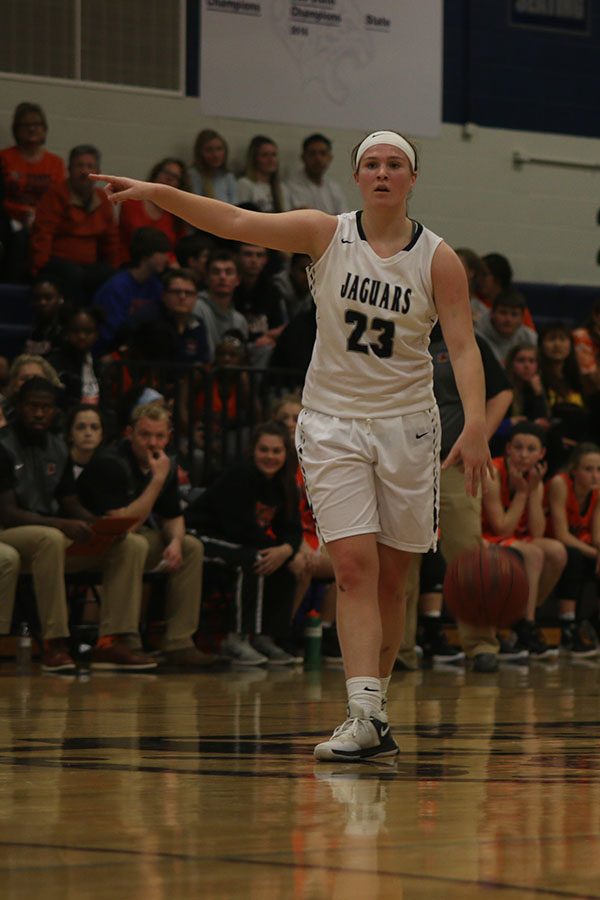 After a time out by the Jaguars, junior Claire Kaifes directs a teammate to their spot on the court.