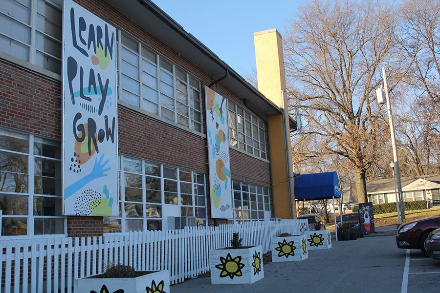 Banners outside the building advertise the Museum motto of Learn, Play, Grow.