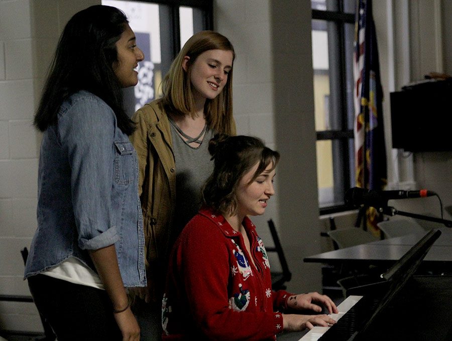 Playing the piano, senior Kiley Beran sings Dead Sea by the Lumineers with seniors Caroline Gambill and Durga Jambunathan.