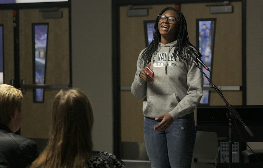 With her peers watching, junior Anna Padden sings.