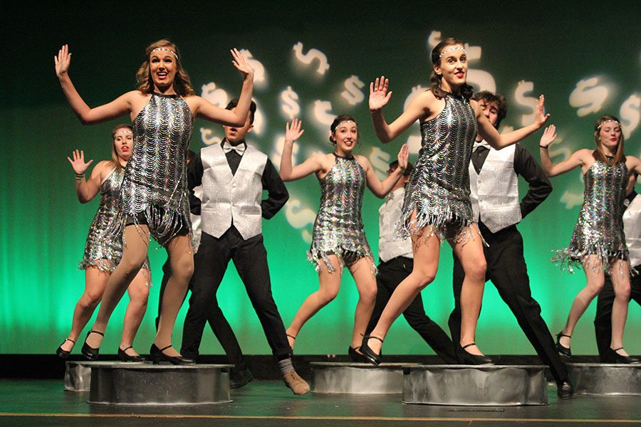 During dress rehearsal on Wednesday, Nov. 1, senior Mckenna Harvey taps on top of a platform resembling a dime during the scene “We’re in the Money.” “Because it is such a big tap show, during rehearsals we spent a lot more time on dances,” Harvey said.
