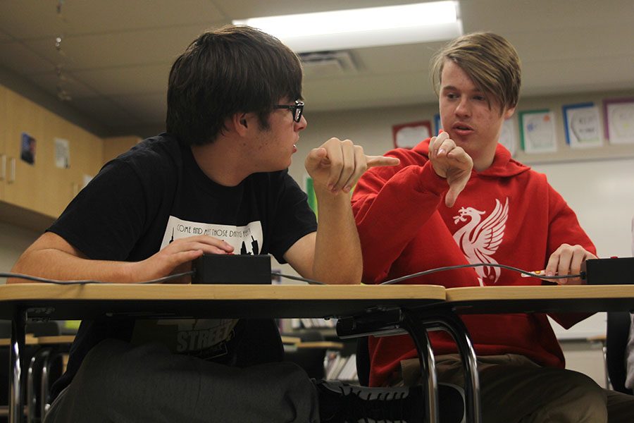 During+a+question+about+the+periodic+table%2C+seniors+Tom+Colling+and+Jarod+Griggs+discuss+the+answer.+In+the+quiz+bowl+tournament+at+De+Soto+High+School+on+Tuesday%2C+Nov.+28%2C+Mill+Valley+had+two+teams+compete+and+finished+in+sixth+place+out+of+36+teams.