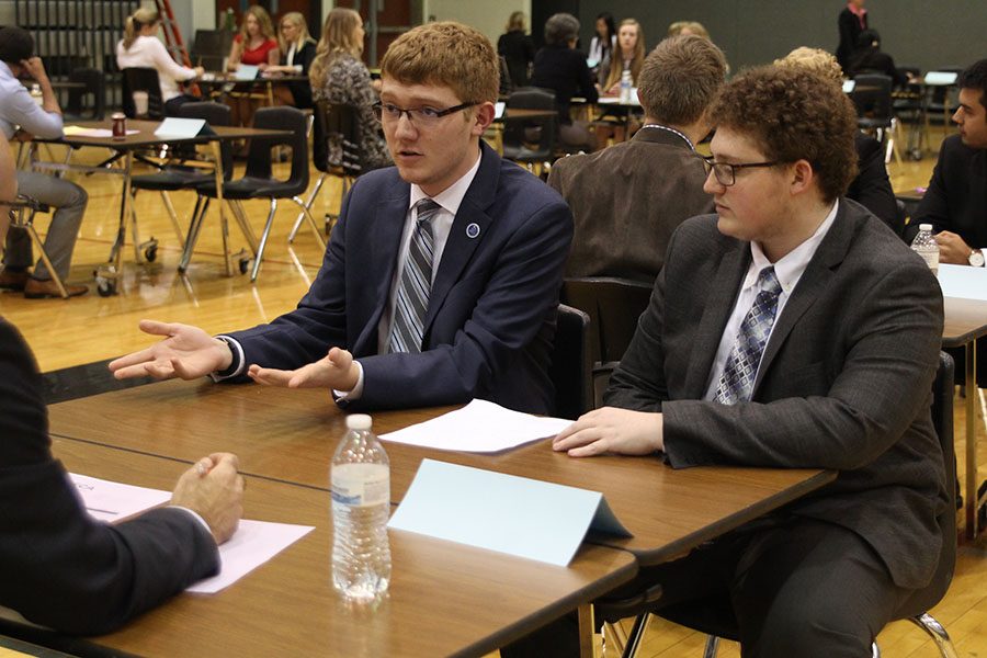Seniors Jared Jenson and Shayne Howell explain their scenario to their judge. Overall, they placed 10th. 