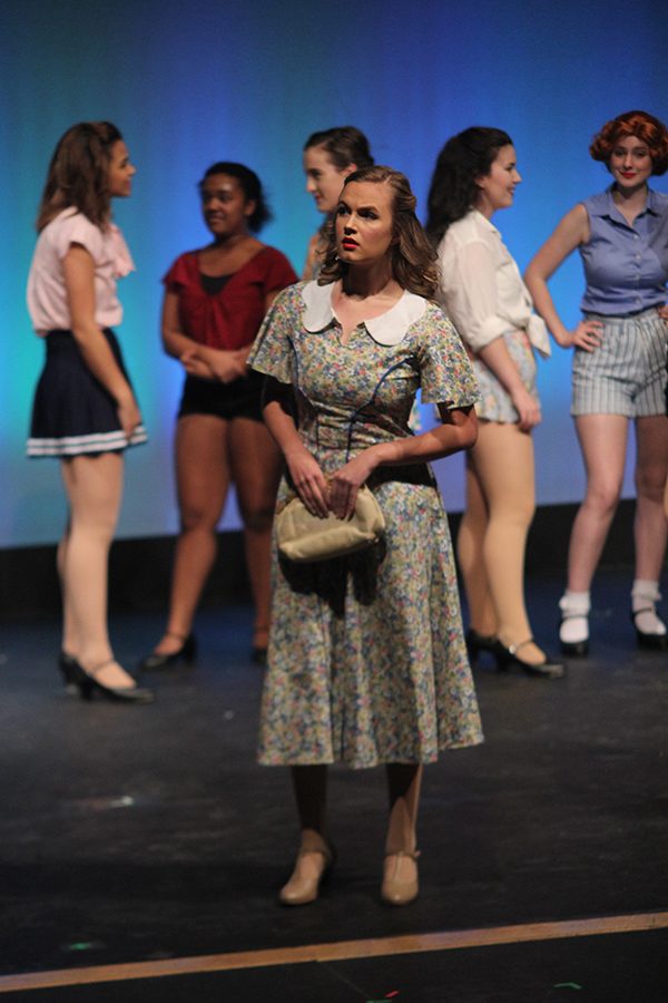 Peggy Sawyer played by senior Mckenna Harvey looks in the distance.