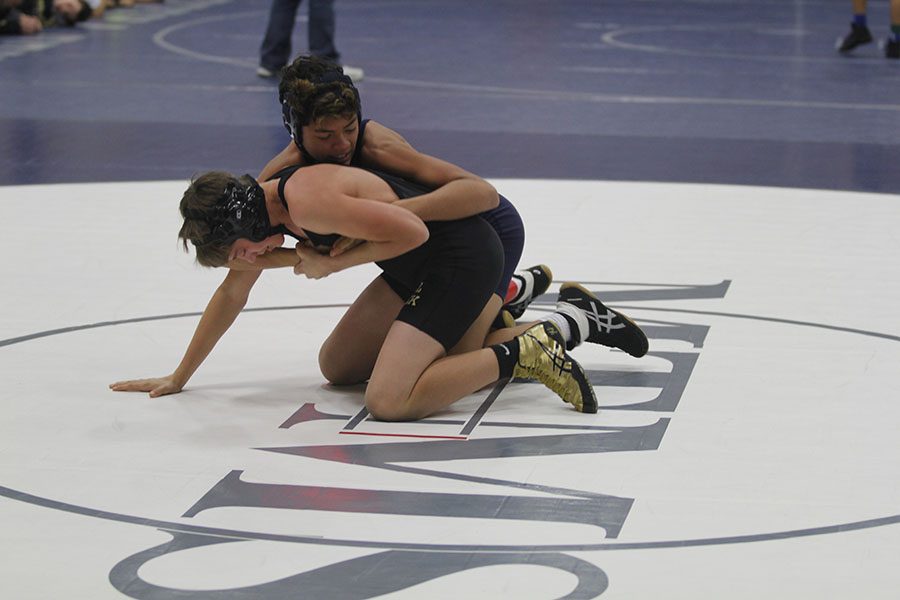 At the quad hosted by Monticello Trails Middle School on Wednesday, Nov. 28, a MTMS wrestler attempts to defeat his opponent. 
