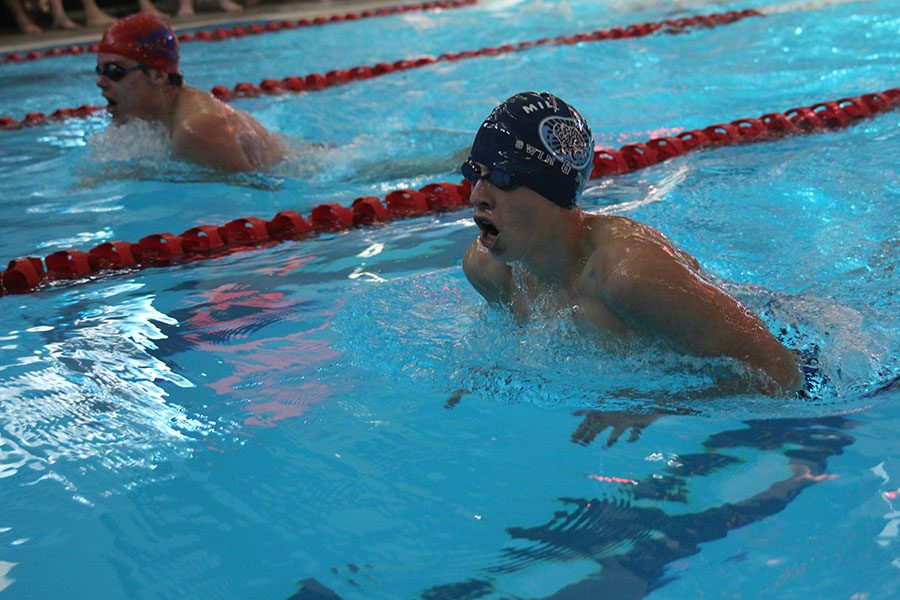 Pushing past the competition, sophomore Avery Lawson competes in the 400 medley relay on Saturday Nov. 2.