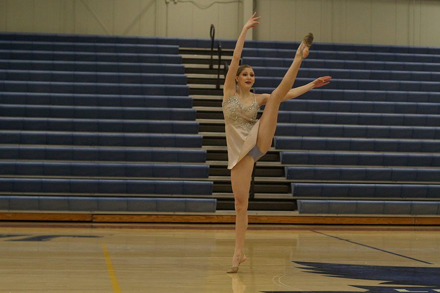 Eyes forward, junior Addie Ward performs her solo.