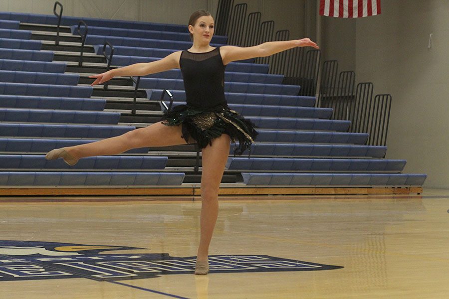 Freshman Kenzie Harris hits a pirouette during her solo. Her routine placed third in the freshman division.