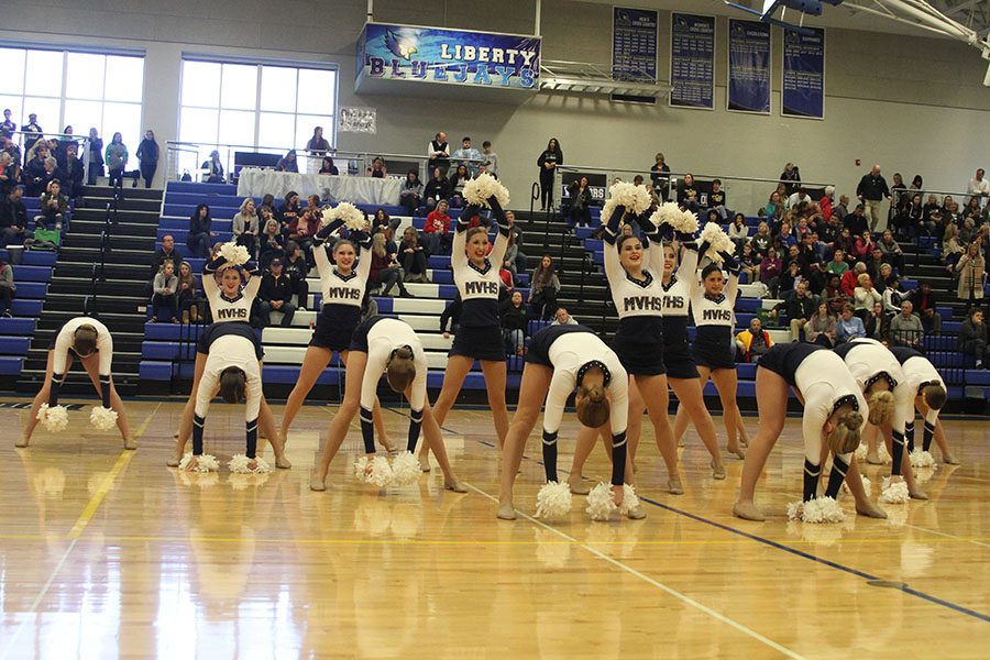 Facing the division three judges, dance team members compete in their pom routine. This pom took third place in the division.