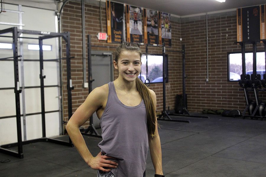 In her Crossfit gym, sophomore Ellie Kerstetter smiles 