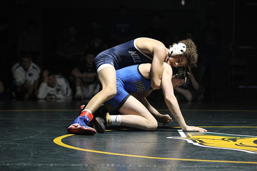 During the final match for the 106 weight class, sophomore Zach Keal tries to get his opponent on his stomach to score points.