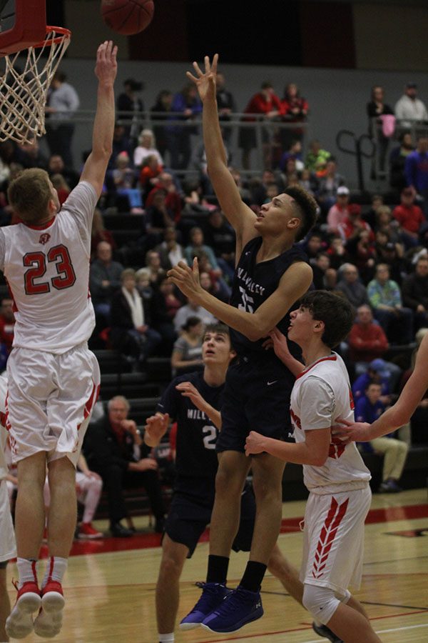 Going for the basket, freshman Keeshawn Mason jumps to score. 