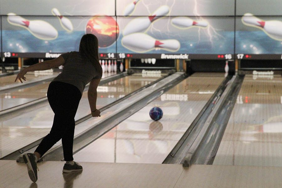 In order to get a spare, sophomore Bri Laluk attempts to knock down her last pin at Olathe Lanes East Bowling Center on Monday, Jan. 22.