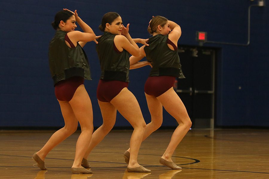 Performing the sophomore ensemble, sophomores Ali Greenhalgh, Samantha Pennington and Sydney Ebner each dance in sync.