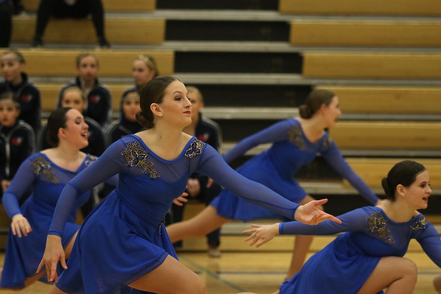 Reaching out, freshman Kenzie Harris competes at the Miss Kansas dance competition. 