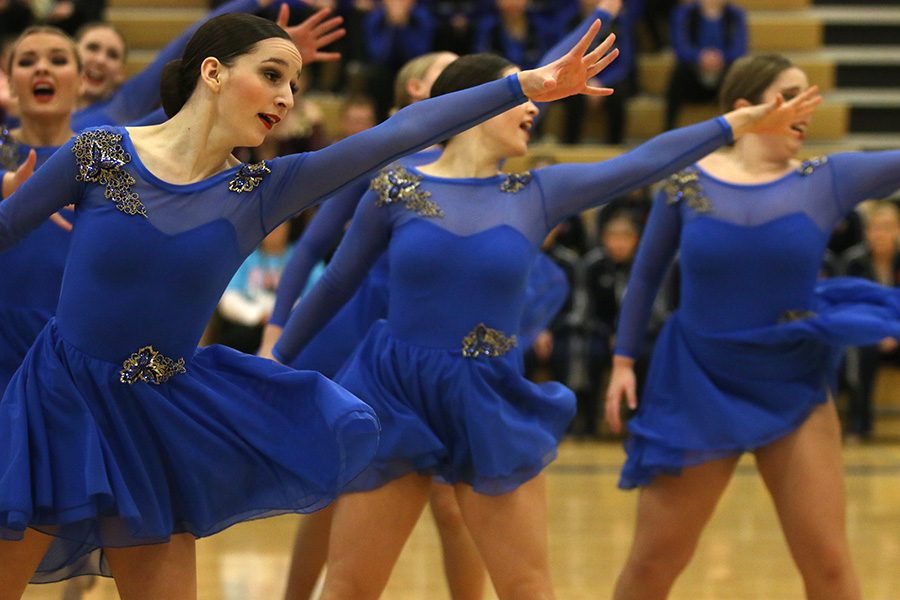 During the jazz routine, freshman Lauren Acree stretches out her arms on Saturday Jan. 13.