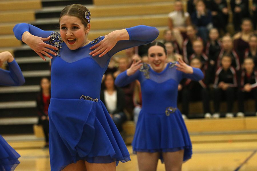 Standing in front of her fellow teammates, sophomore Sydney Ebner performs the jazz routine on Saturday, Jan. 13.