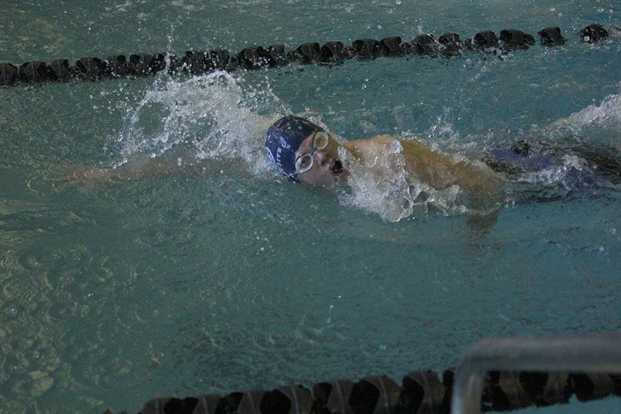 Swimming in the 200 yard freestyle, freshman Noah Collins returns to the blocks after finishing a lap at the Turner Invitational on Monday, Jan. 8.