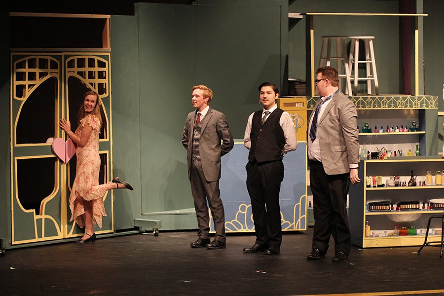 Seniors McKenna Harvey, Tyler Orbin, Graham Wilhauk and junior Nathan Sheehan sing as "customers" walk out the door. 