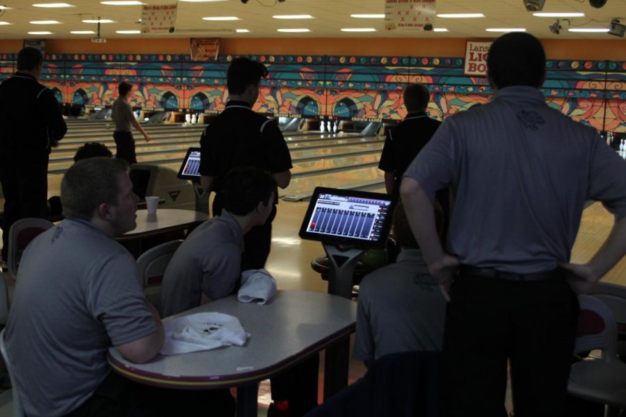 Preparing to begin the frame, seniors Trey Callahan, Brent Stevenson, Bradley Teasley and Clark Harris discuss their strategy for the meet. The bowling meet was held in Leavenworth at Crown Lanes versus Lansing on Tuesday, Jan. 16.