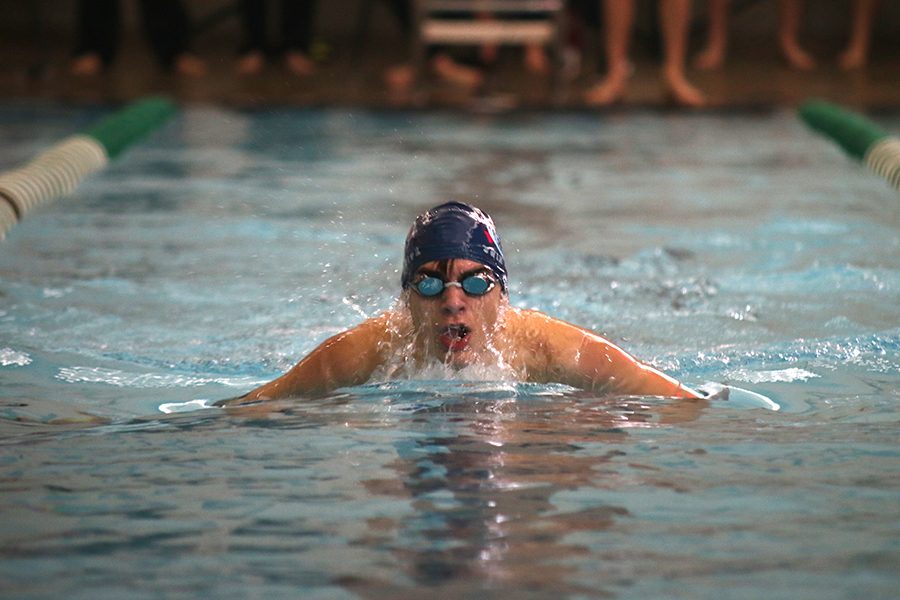 Swimming at the Timberwolf Invitational at Blue Valley Southwest, freshman Cole McClure swims the breaststroke on Saturday, Jan. 20.  