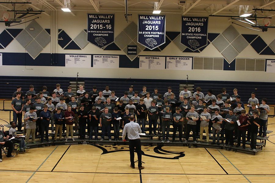 Gathered in the gymnasium on Monday, Jan. 8, students in the USD 232 school district sing together during a tenor/bass choral festival.