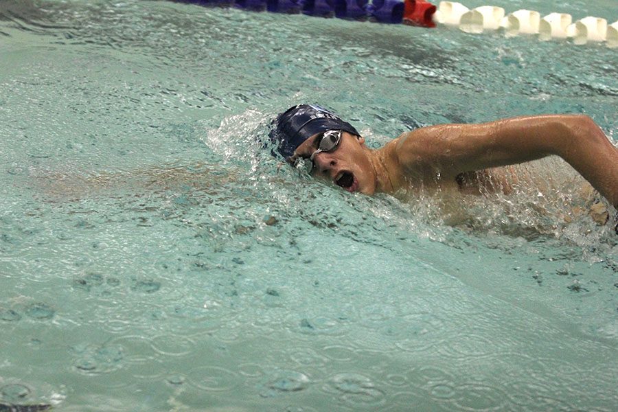 Turning for a breath, freshman Cole McClure swims the 500 free at Chisholm Trail Middle School on Wednesday, Jan. 17.