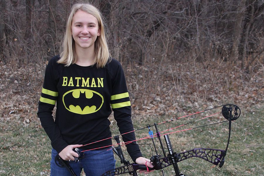 With bow in hand, sophomore Callie Roberts shows off her archery equipment on Tuesday, Jan 9.