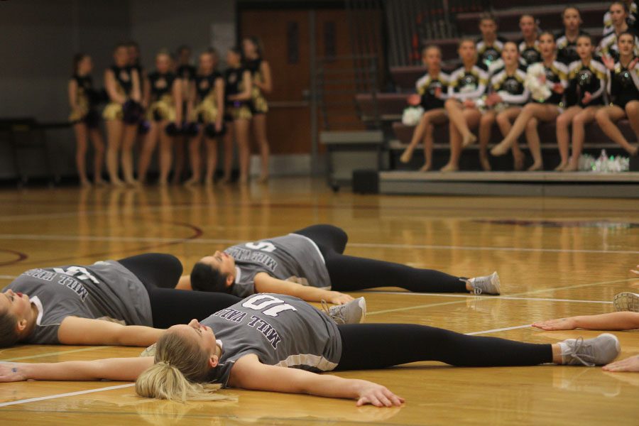 The hip hop routine ends by dancers falling to the floor.