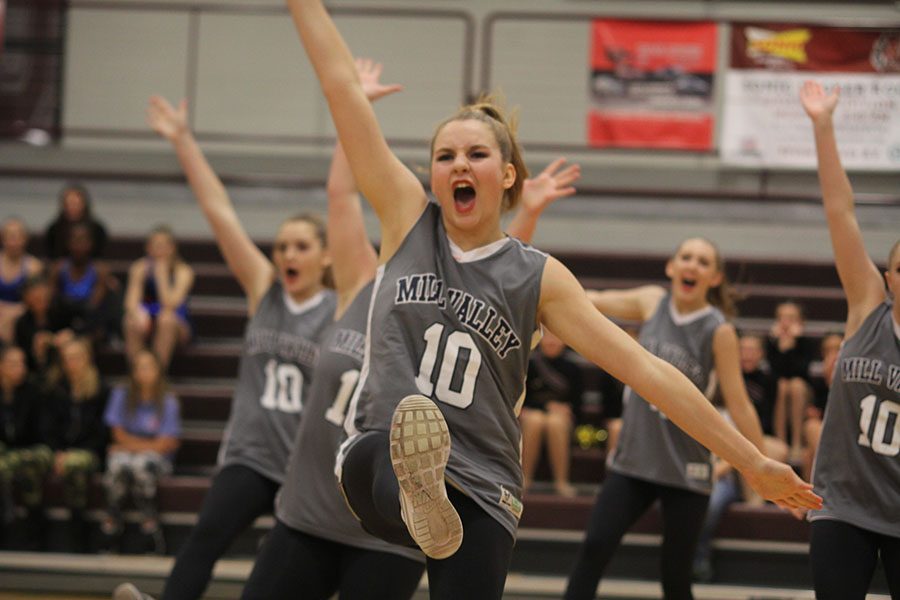 Arms outstretched, sophomore Sydney Ebner performs in the hip hop routine. Hip hop placed third at the Lees Summit North Invitational.