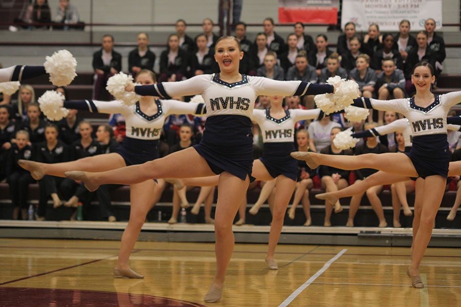 Freshman Jenna Haase dances in the pom routine.