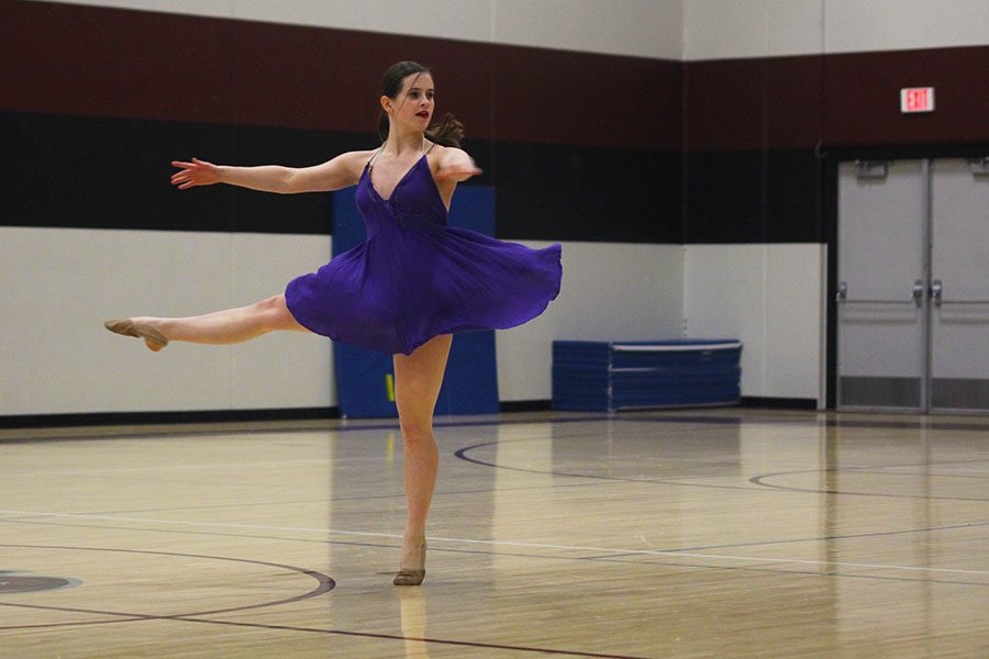 Junior Olivia Augustine pirouettes in her solo routine.