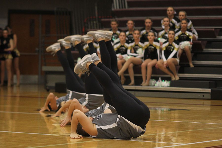 As other teams watch, the Silver Stars kick up their shoes in the hip hop routine.