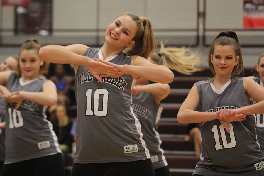 Smiling, sophomore Sydney Ebner performs in the hip hop routine.