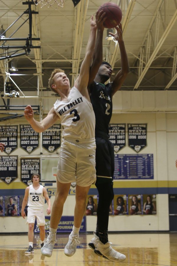 After a missed shot, senior Sammy Rebeck goes for the rebound.