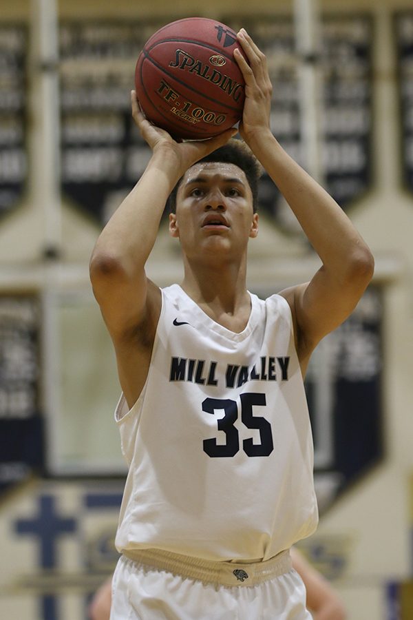 Focusing, freshman Keeshawn Mason shoots a free throw.