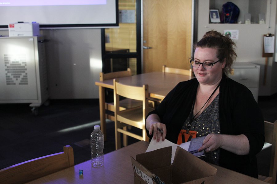 New York Times bestselling author Beth Revis signs a copy of her book at an author visit in the library on Thursday, Jan. 18.