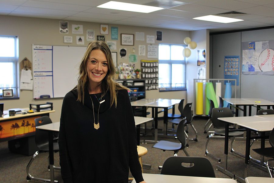 Math teacher Sarah Sides takes photos for her daily fashion blog in her classroom. She poses in her favorite outfit and then puts the photo with information about the clothing on each post.