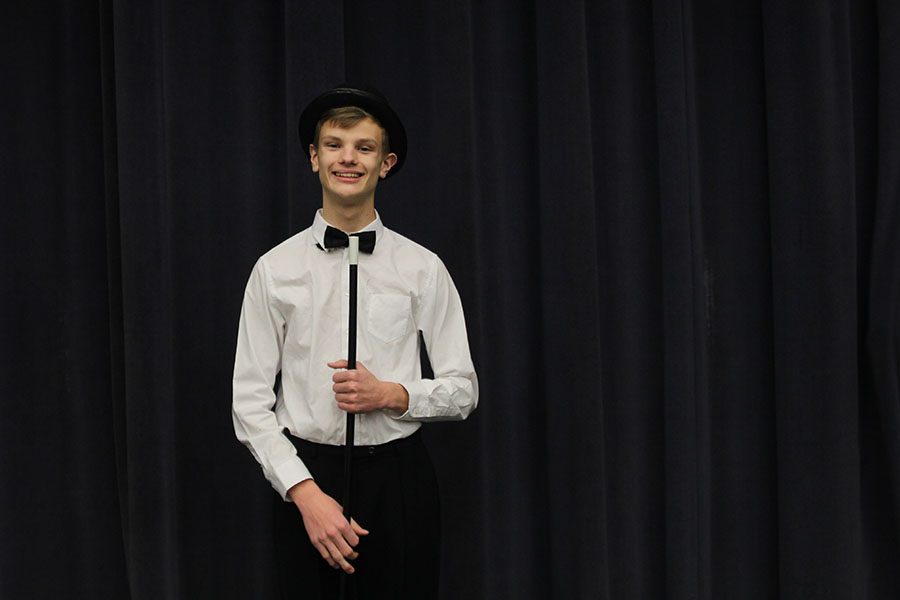 With a wand in hand, freshman Leif Campbell stands in the Little Theater, on Tuesday, Jan. 16.