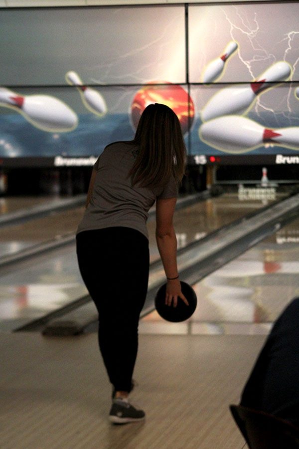 On her final turn, Sophomore Bri Laluk rolls her bowling ball, receiving a strike.